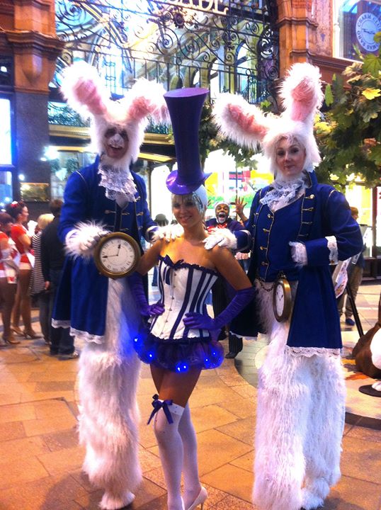 White rabbit stilt walkers